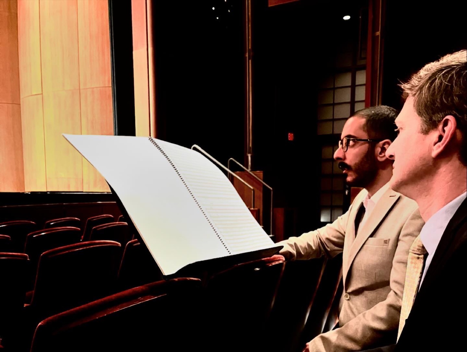 Mahbod Shirvani with the conductor at a music stand